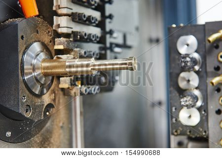 Metalworking industry. close-up view of brass detail during cutting process on moderm machining center