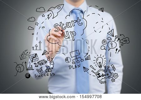 Businessman Drawing Project Launching Sketch On Glassboard
