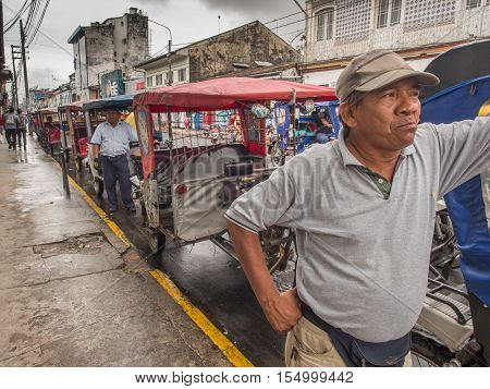 Rickshaws On A  Street