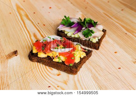 Smorrebrod - danish open sandwich with fish herring cheese