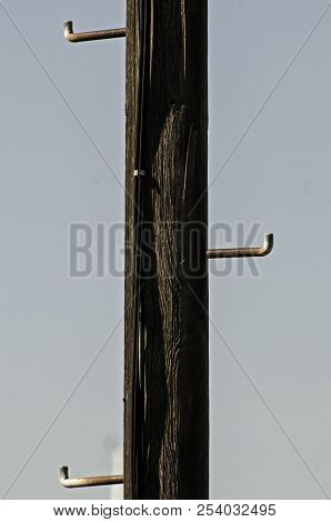 Old Wooden Power Line Pillar With Steel Footholds