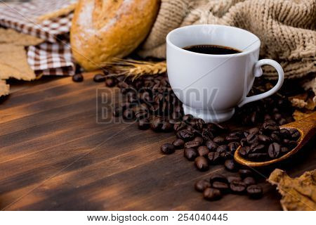 Cup Of Hot Coffee With Toast For Autumn Season Warm Drink. Fall Harvest Cornucopia. Copy Space On Wo