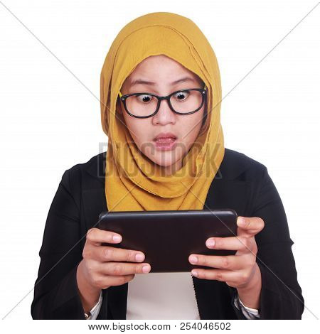 Young Businesswoman Shocked When Looking At Her Tablet