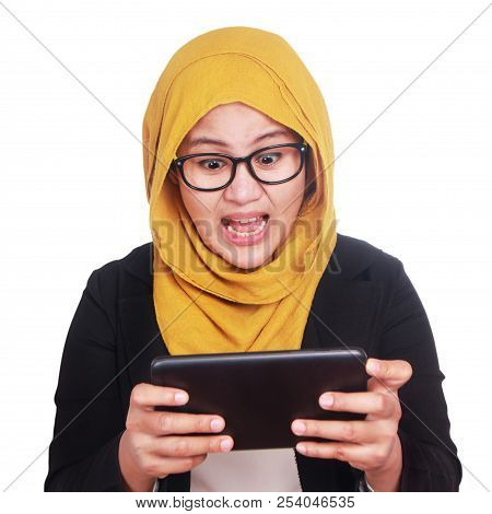 Young Businesswoman Shocked When Looking At Her Tablet