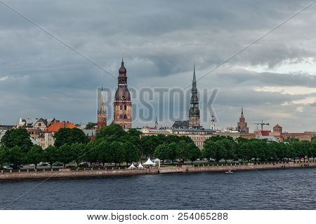 View Of The Spiers Of The Cathedrals Of The Old City Of Riga, From The Daugava River