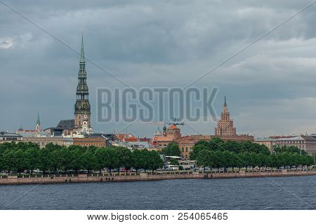 View Of The Spiers Of The Cathedrals Of The Old City Of Riga, From The Daugava River