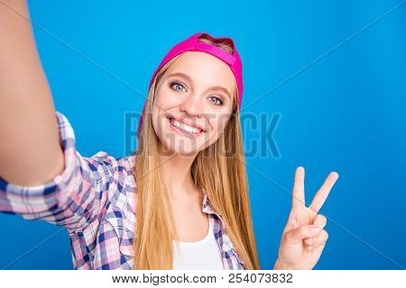 Peace! Young Woman With Blond Hair Making A Selfie On The Camera, Playful And Happy. With Funky Mood