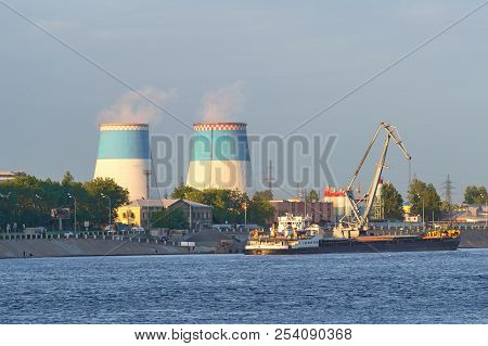 The Towers Of A Thermal Power Plant, Against A Background Of The