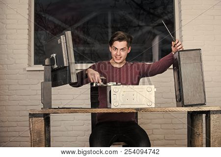 Repairman Or Smiling Man Fix System Unit Of Computer Device And With Monitor Screen Or Display Screw