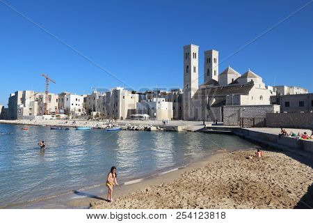 Molfetta, Italy - May 28, 2017: People Visit Molfetta Beach In Apulia Region, Italy. With 50.7 Milli