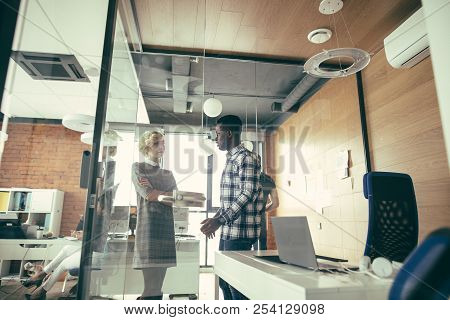 Manager And Handsome African Partner In Casual Clothes Are Talking
