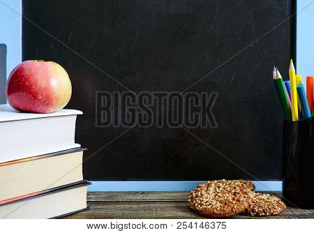 Back To School, Education Concept. Book, School Supplies Useful, Whole-grain Cookies And Apple On Cl