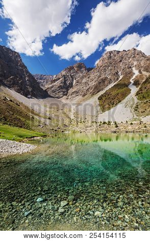 Beautiful serene lake in  Fann mountains (branch of Pamir) in Tajikistan.