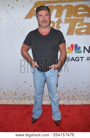 LOS ANGELES - AUG 14:  Simon Cowell arrives to the'America's Got Talent' Live Show Screening and Red Carpet  on August 14, 2018 in Hollywood, CA                