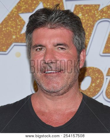 LOS ANGELES - AUG 14:  Simon Cowell arrives to the'America's Got Talent' Live Show Screening and Red Carpet  on August 14, 2018 in Hollywood, CA                