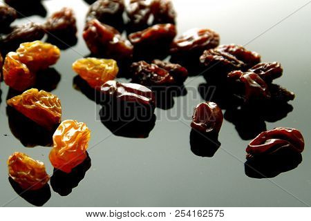 Raisins Background / A Raisin Is A Dried Grape. Raisins Are Produced In Many Regions Of The World An