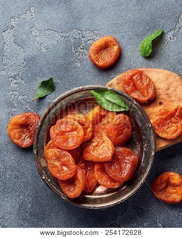 Dried Apricots On Gray Background With Copy Space. Top View.