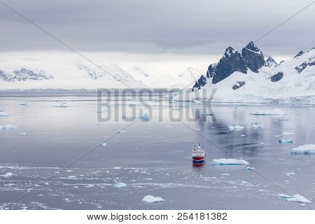 Ice In The Antarctica With Iceberg In The Ocean