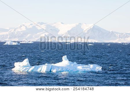 Ice In The Antarctica With Iceberg In The Ocean
