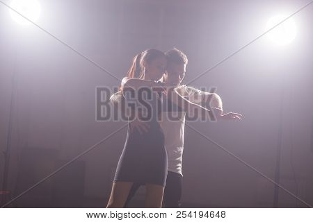 Young Couple Dancing Social Danse Kizomba Or Bachata Or Semba Or Taraxia In Dancing Class Background
