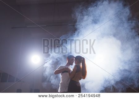 Young Couple Dancing Social Danse Kizomba Or Bachata Or Semba Or Taraxia In Dancing Class Background