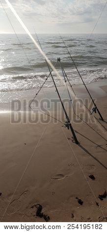 Fishing Rods In The Baltic Sea Beach