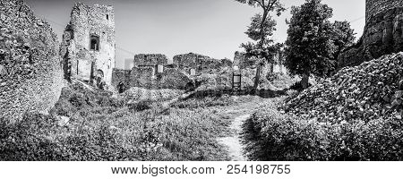 Ruins Of The Castle Gymes In Slovak Republic. Travel Destination. Panoramic Photo. Black And White P