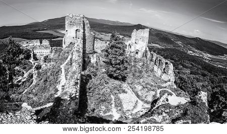 Ruins Of The Castle Gymes In Slovak Republic. Travel Destination. Panoramic Photo. Black And White P