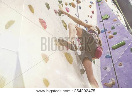 Woman With Perfect Fit Body Training On A Climbing Wall In Sport Hall, Ready To Workout
