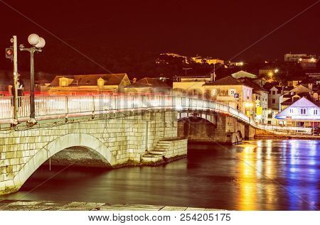 Bridge From Trogir To Ciovo Island, Croatia. Night Scene. Travel Destination. Red Photo Filter.