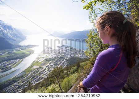 Girl Hiker With A Backpack Looking On Romsdalsfjorden And Andalsnes, Norway