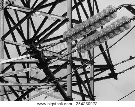 Fragment Of High-voltage Tower. Power Line. Metalware. Black And White Photo. Bnw. Urban Grunge