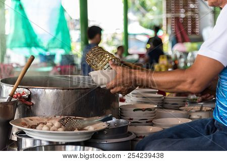 Chef Cooking A Noodle Soup At Street Food Market