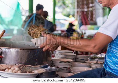 Chef Cooking A Noodle Soup At Street Food Market