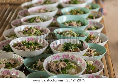 Spicy Tom Yum Noodle With Pork For Sale At Thai Street Food Market Or Restaurant In Thailand