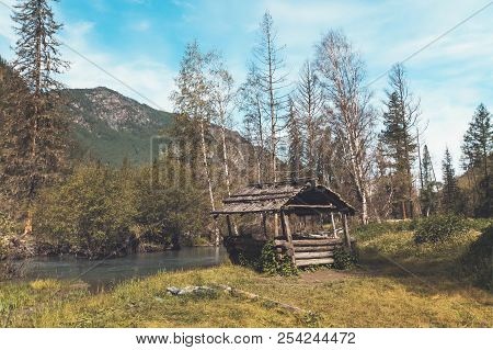 Wooden Pergolas Near The Road In The Altai Siberia Russia. Beautiful Mountain Landscape