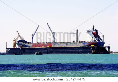 Cranes To Repair Boats In The Bay Of Cadiz Capital, Andalucia. Spain