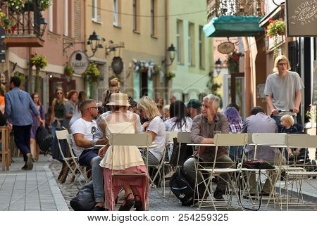 Vilnius, Lithuania - August 18: Unidentified People In Vilnius Old Town Street Cafe On August 18, 20