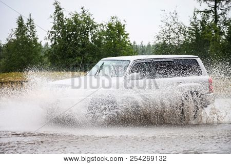 Novyy Urengoy, Russia - August 14, 2018: Motor Car Nissan Patrol In The City Street During A Heavy F