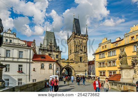 Prague, Czechia - September 26 2016: Tourists Cross The Charles Bridge On The Path Of The Kings Lead
