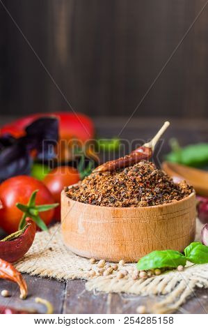 Heaps Of Various Ground Spices On Wooden Background. Georgian Spices, Indian Spices, Arabian Spices.