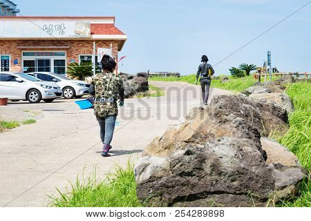 Seongsan, Jeju Island, South Korea - August 29 2017: Haenyeo Traditional Female Fishing Divers Walki