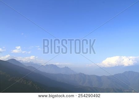 Morning Mountain Landscape With Layer Of Mountain Peaks Covered With Coniferous Deciduous Forests. V