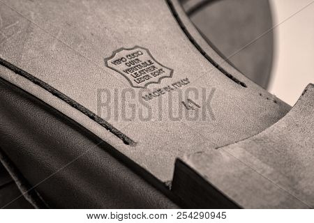 Stamp Of Genuine Leather On The Sole Of Shoes. A Real Leather Badge On The Sole Of Shoes.