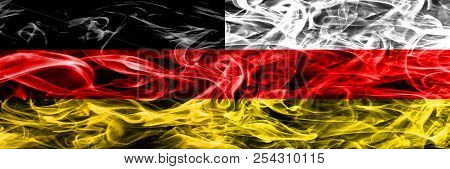 Germany Vs South Ossetia Smoke Flags Placed Side By Side. German And South Ossetia Flag Together