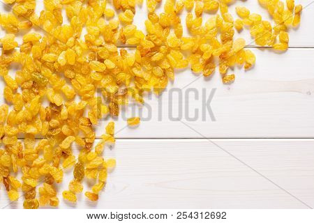Lot Of Whole Dry Golden Raisins Sultana Variety Left Upper Corner Flatlay On Grey Wood