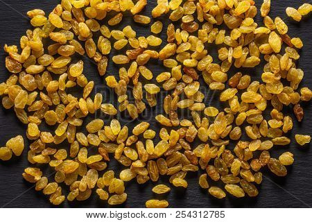 Lot Of Whole Dry Golden Raisins Sultana Variety Flatlay On Grey Stone