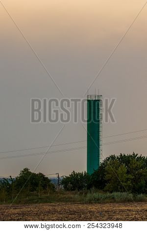 Small Silo Tower In Rural On Sunset