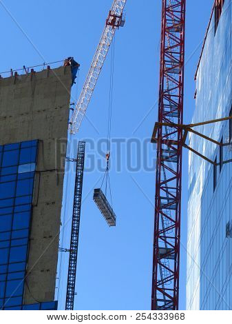 Hoist Of The Crane With A Heavy Load. Construction Of A High Bui