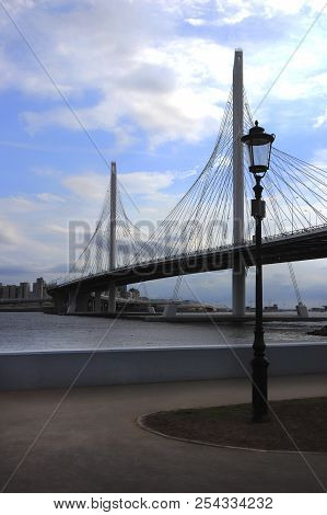 Zsd Bridge Above Neva River With Black Lantern On Embankment Pedestrian Zone
